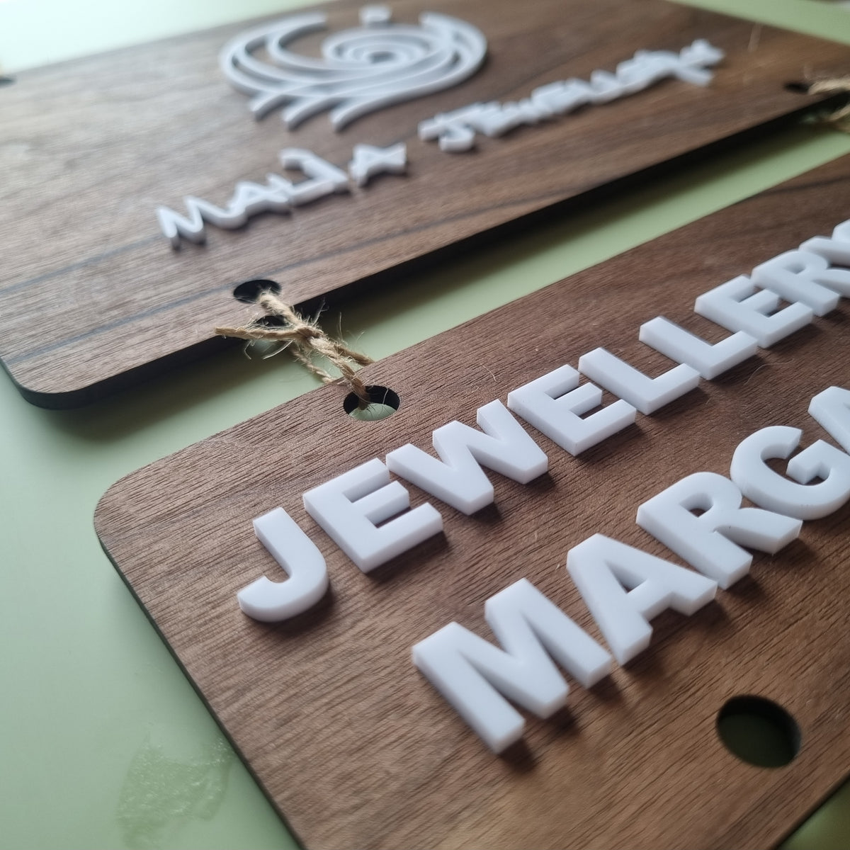 Hanging tiered signs